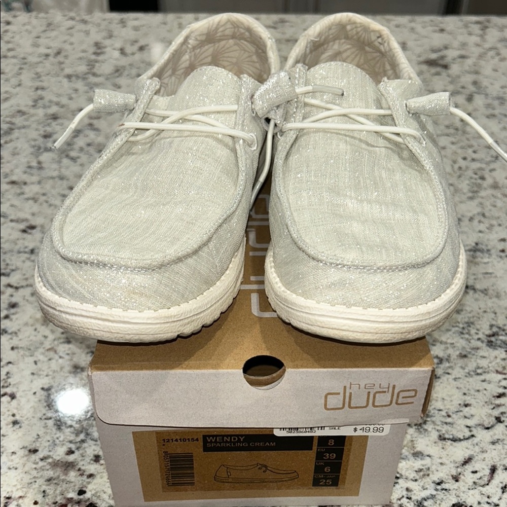 Hey Dude Cream Slip-On Loafers with Moccasin Style